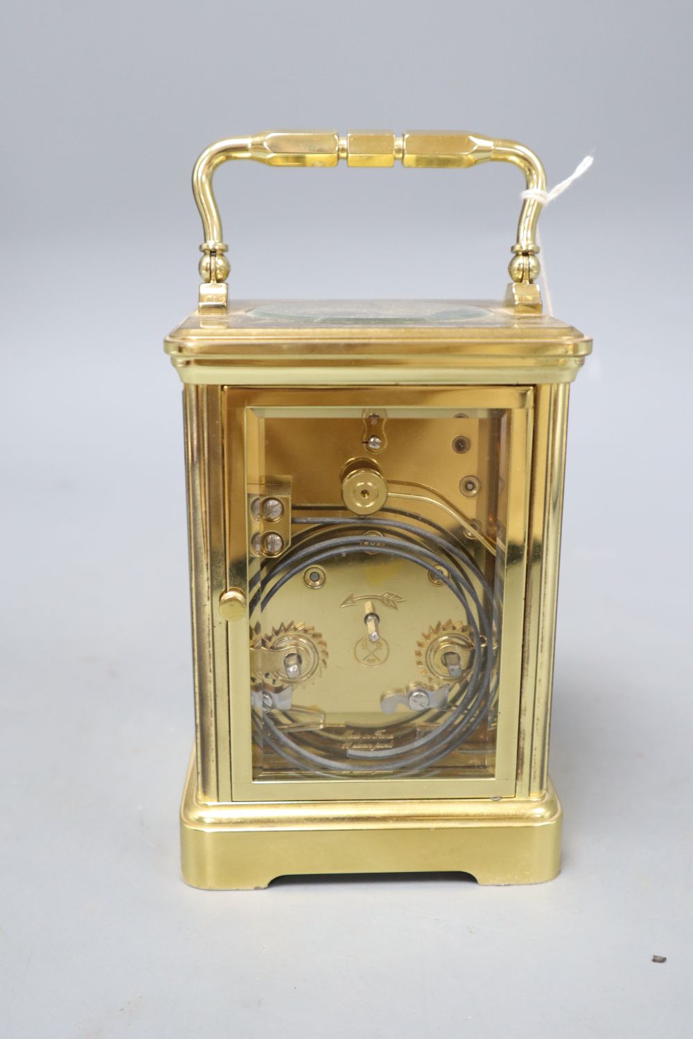 A modern gilt brass enamel dial upright rectangular striking carriage clock, signed Angelus to white Roman dial, overall height 14.5cm